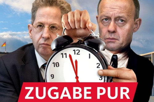 Satirische Fotomontage: Friedrich Merz und Hans-Georg Maaßen vor dem Spreebogen, Merz hält einen großen Wecker in der Hand, dessen Zeiger "kurz vor 12